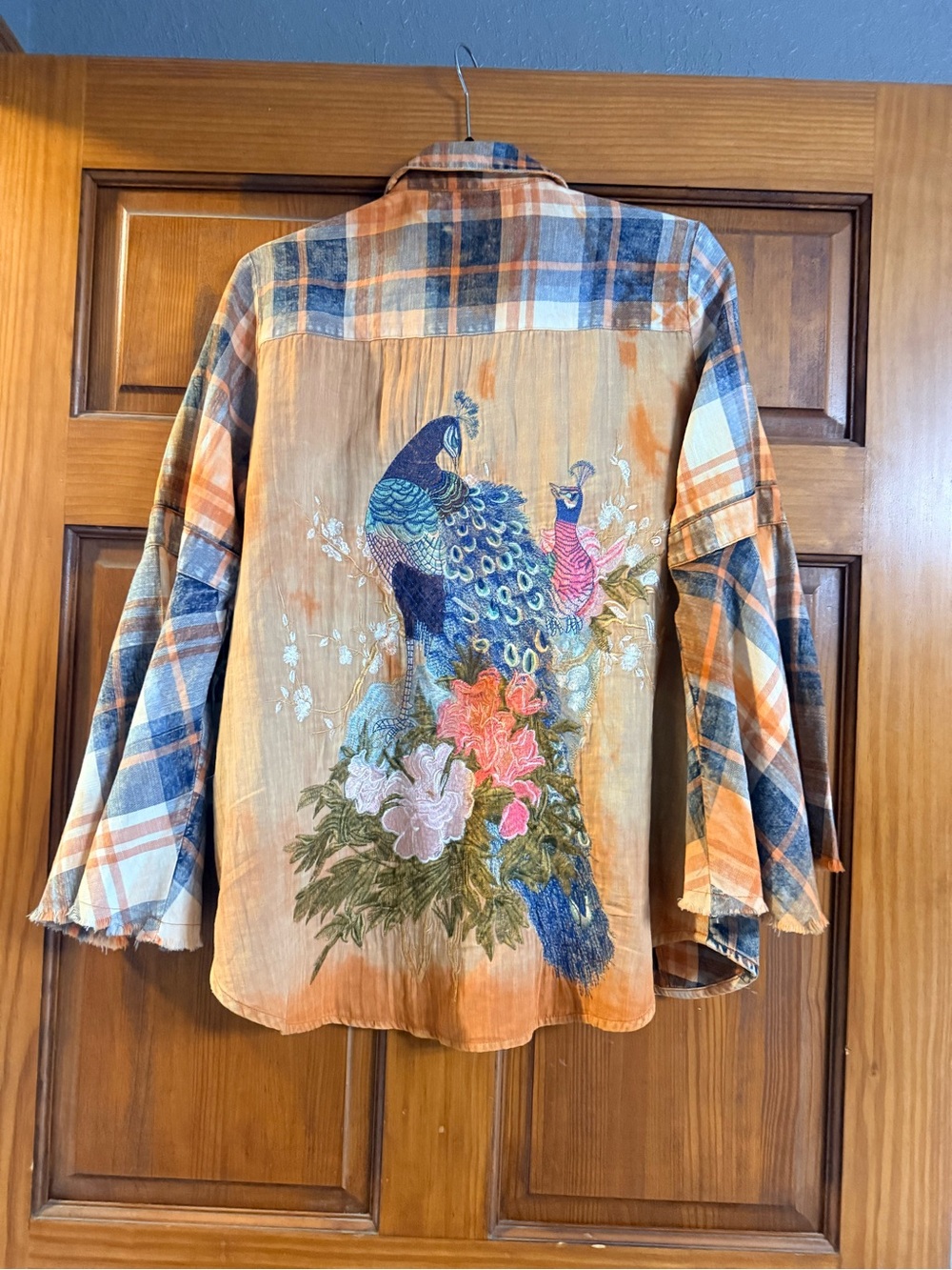 Beautiful embroidered peacock flannel with bell sleeves from Aratta